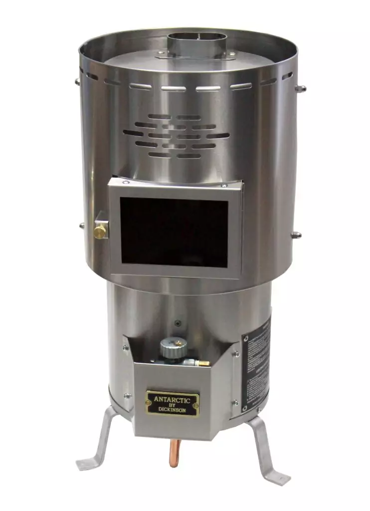 Dickinson Antarctic floor-mounted diesel marine heater in stainless steel, featuring a large glass viewing window and 16,250 BTU heat output, shown on a white background.