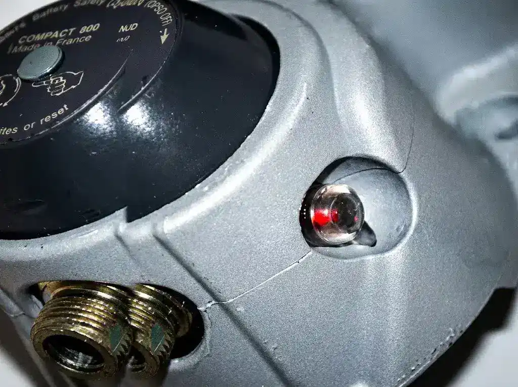 Close-up of a Clesse marine LPG regulator with the OPSO indicator window showing red tripped status