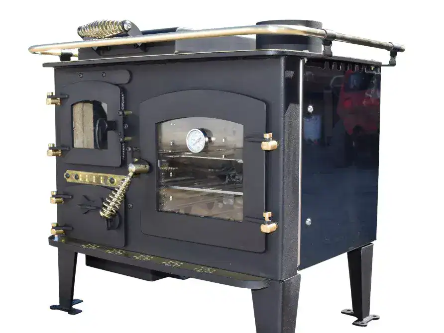 A close-up profile of the Bubble Diesel Boat Cooker showing its cast iron construction, brass fittings, and oven temperature gauge.