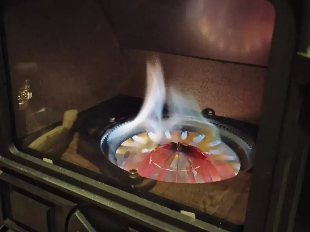 Clean blue flame and glowing catalyst ring in a professionally serviced vaporising diesel boat burner