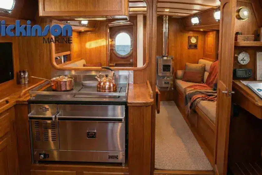 Professional installation of a Dickinson diesel boat stove and cooker in a boat galley by Marine Heating Solutions' OFTEC-certified engineers, ensuring BSS safety compliance and efficient cabin heating.
