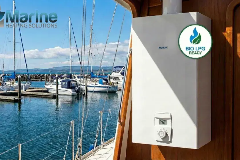 Morco EUP11RS Bio LPG ready instantaneous gas water heater installed in a boat cabin with a marina background.