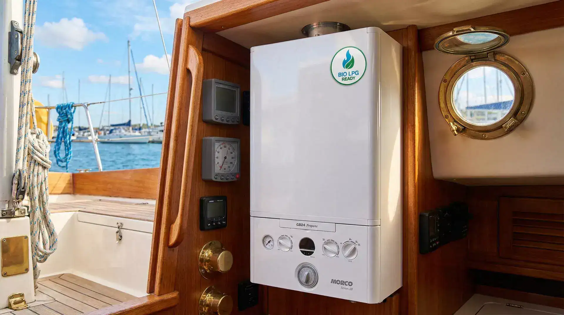 Morco GB24 propane boiler installed on a wood-paneled bulkhead inside