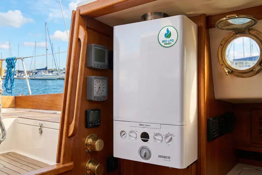 Morco GB24 propane boiler installed on a wood-paneled bulkhead inside