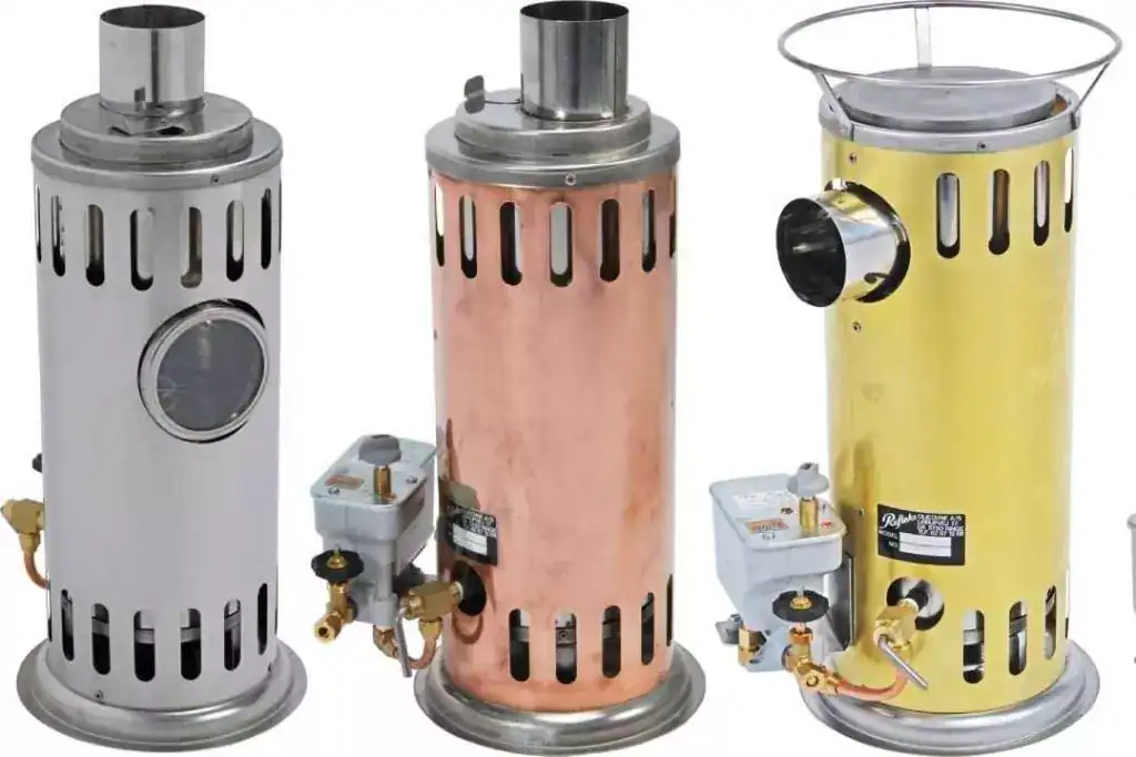 Three Refleks 66M diesel boat stoves shown side-by-side in polished stainless steel, copper, and brass finishes.