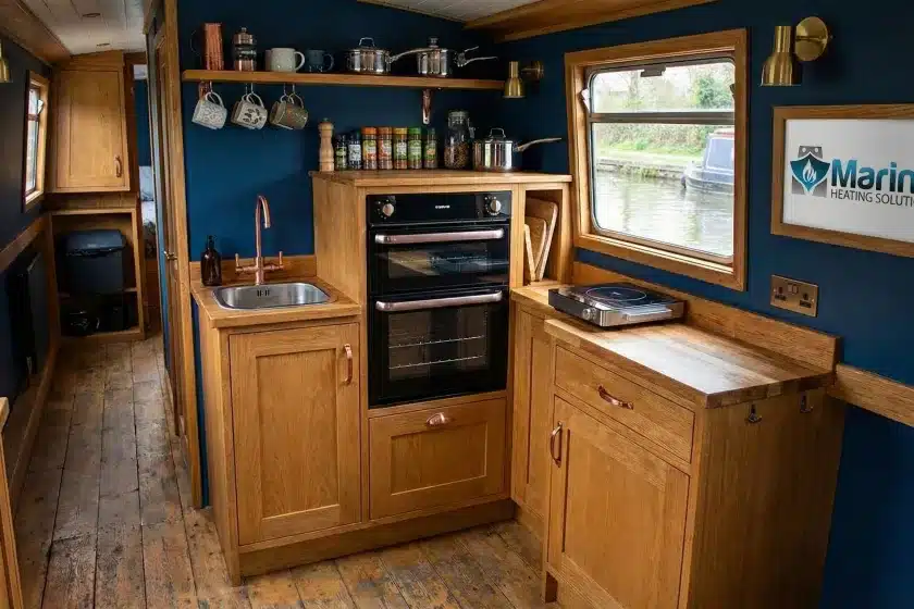 Thetford Midi Prima 4 black LPG oven and grill installed in a modern narrowboat kitchen by Marine Heating Solutions.