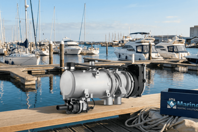 Webasto Thermo Pro 90 9.1kW diesel water heater on a marina dock with yachts in the background, showcasing its marine heating application.