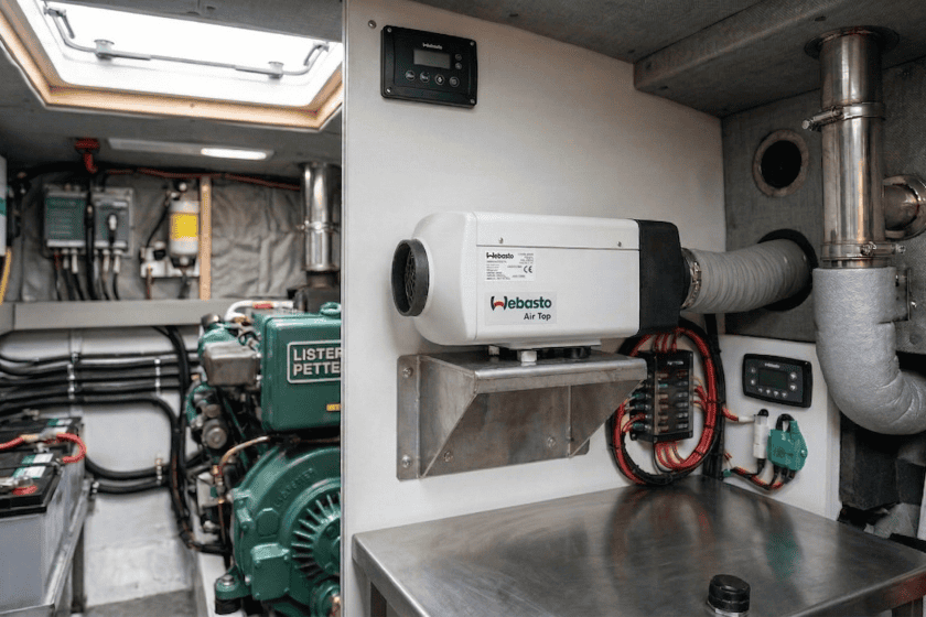 Professional Webasto diesel heater installation in a narrowboat, featuring marine-grade exhaust insulation and secure fuel lines for BSS compliance.