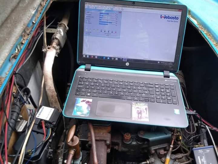 A laptop running official Webasto Thermo Test software connected to a marine diesel heater to diagnose fault codes and performance data.