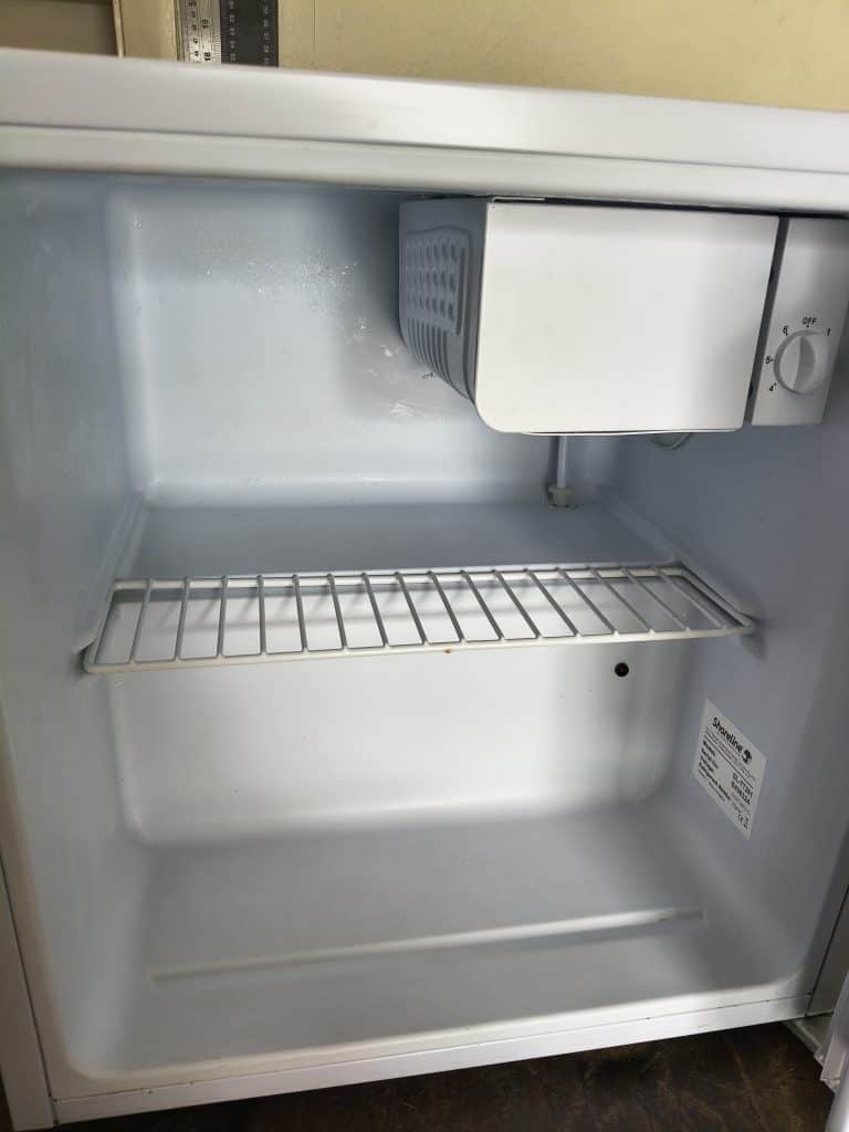 Interior cavity view of Shoreline SL-TT261 12V fridge with ice box