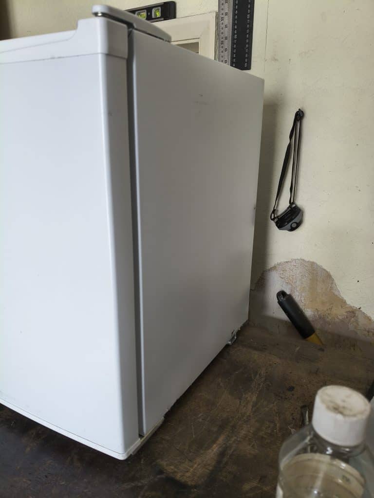 Right side view of white Shoreline 12V DC fridge